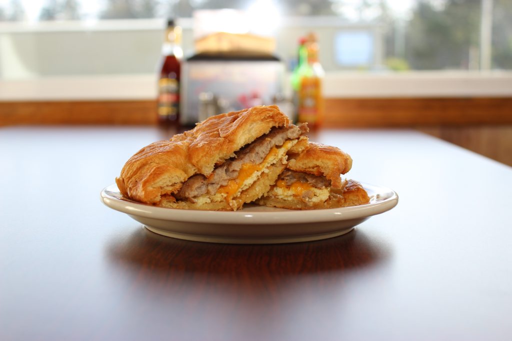 Sausag, egg and cheese croissant sandwich.